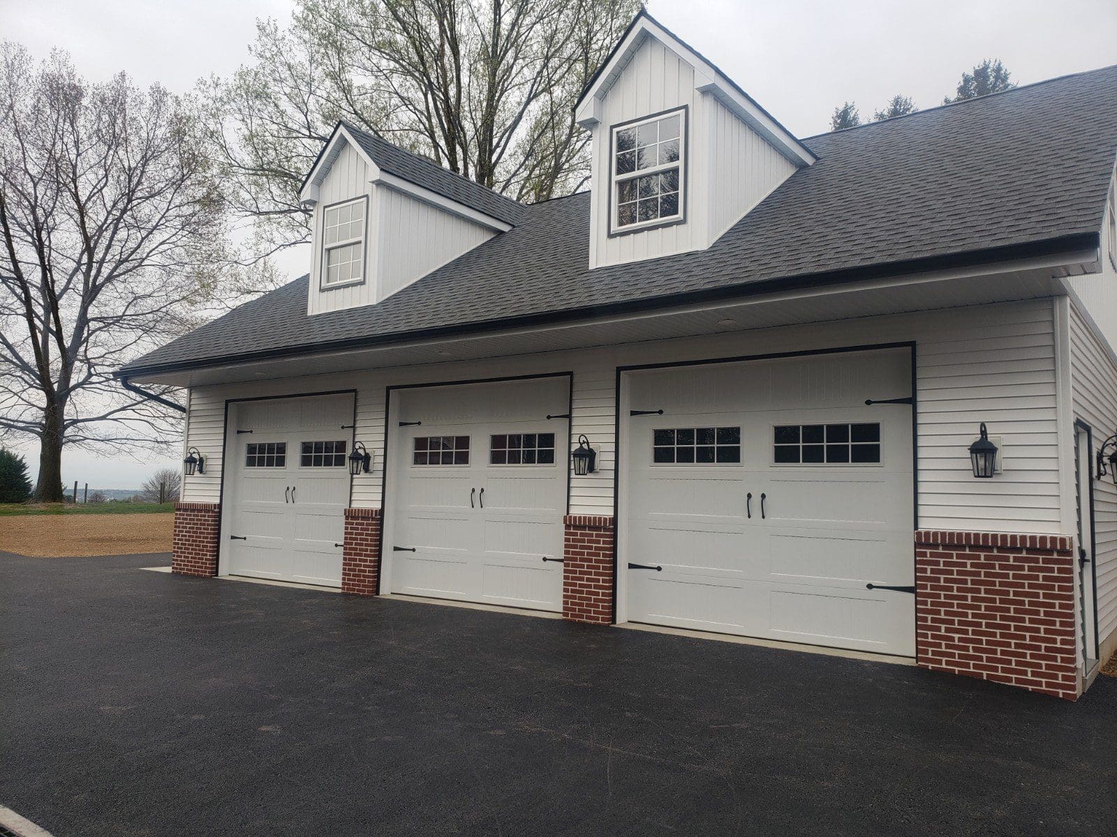 three white garage doors installed
